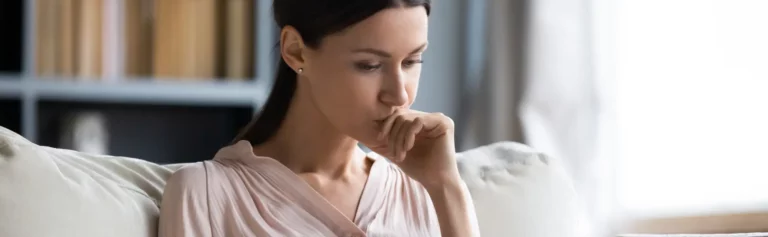 Lady pondering on couch